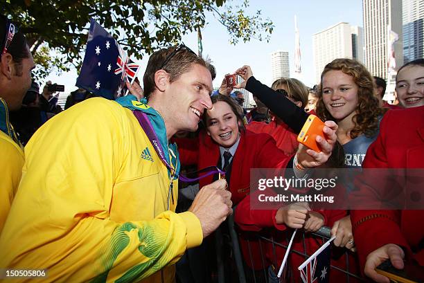 Jacob Clear interacts with the public during the Australian Olympic Team Homecoming Parade in the Sydney CBD on August 20, 2012 in Sydney, Australia.