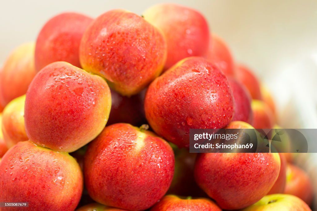Fresh and Plentiful: Stacked Apples in the Supermarket