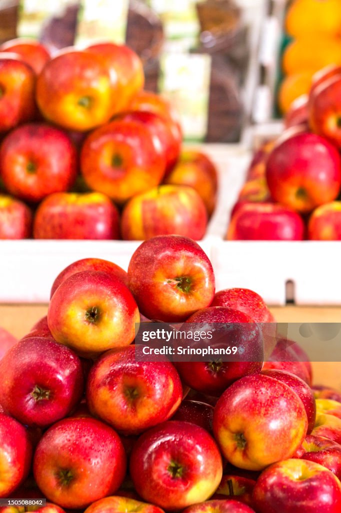 Fresh and Plentiful: Stacked Apples in the Supermarket