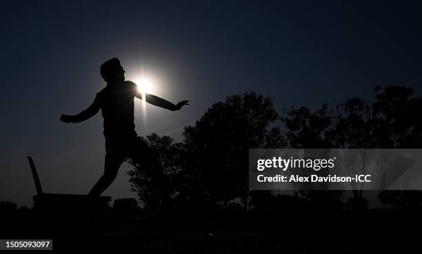 George Dockrell of Ireland warms up ahead of the ICC Men's Cricket World Cup Qualifier Zimbabwe 2023 Playoff match between Ireland and USA at...