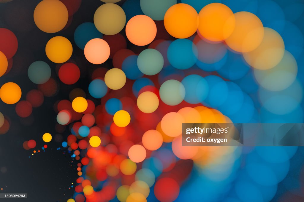 Abstract Gold Blue Yellow Blured Bokeh Swirl Circles Background. Christmas Holiday, New Year Luxury Pattern Macro Texture