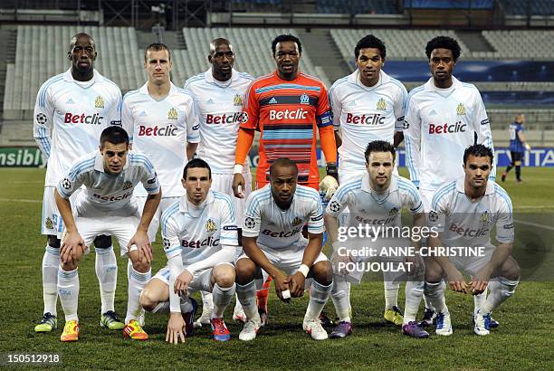 Olympique de Marseille's team poses for photographers on February 22, 2012 at the Velodrome stadium in Marseille, southern France, before the UEFA...