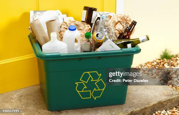 rubbish for recycling on a doorstep for collection - recycling stockfoto's en -beelden