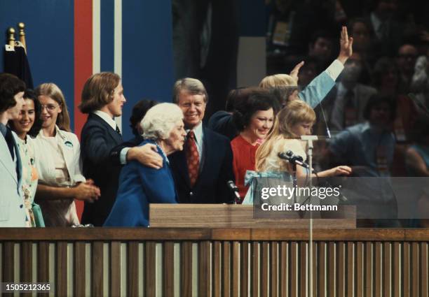 Presidential candidate Jimmy Carter and members of his family wave to delegates at the Democratic National Convention held at Madison Square Garden,...