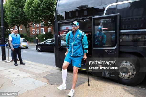 Nathan Lyon of Australia arrives on crutches after injuring his calf yesterday during Day Three of the LV= Insurance Ashes 2nd Test match between...