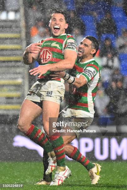 Cameron Murray of the Rabbitohs celebrates with Cody Walker of the Rabbitohs after scoring a try during the round 18 NRL match between New Zealand...