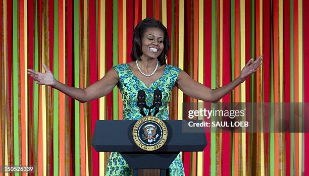 First Lady Michelle Obama speaks during a Kids' "State Dinner" in the East Room of the White House in Washington, DC, August 20, 2012. This first...