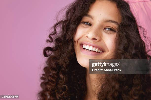 cute teenager wearing a pink rain jacket - freckle smile stock pictures, royalty-free photos & images