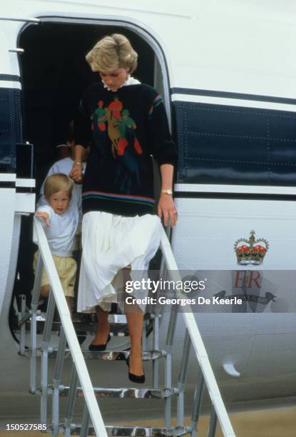 Diana, Princess of Wales, with her young sons Prince William and Prince Harry arrive at Aberdeen Airport for the start of their holidays in Scotland...