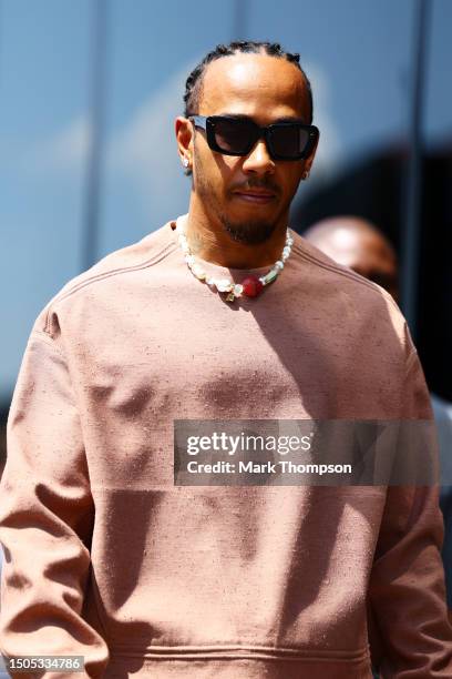 Lewis Hamilton of Great Britain and Mercedes walks in the Paddock prior to practice ahead of the F1 Grand Prix of Austria at Red Bull Ring on June...