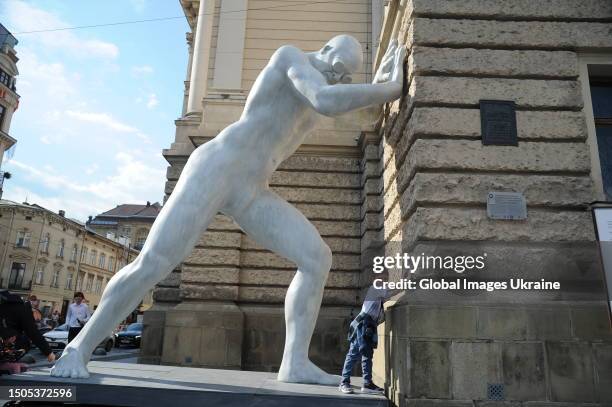 People made pictures of artwork "Mr Arbitrium" which install near Lviv Opera on June 29, 2023 in Lviv, Ukraine. The sculpture will be in Lviv until...