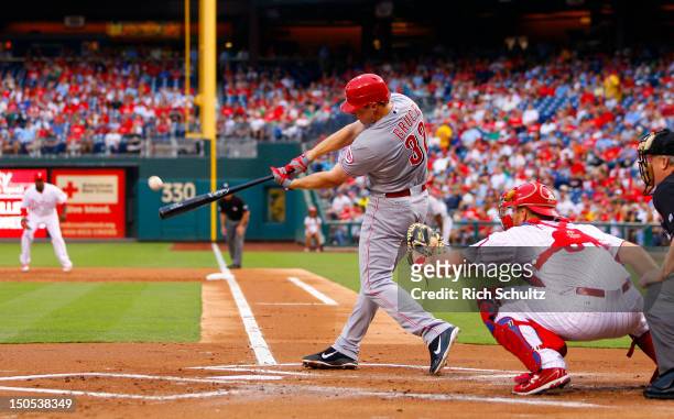 Jay Bruce of the Cincinnati Reds hits an RBI double in the first inning against the Philadelphia Phillies during a MLB baseball game on August 20,...