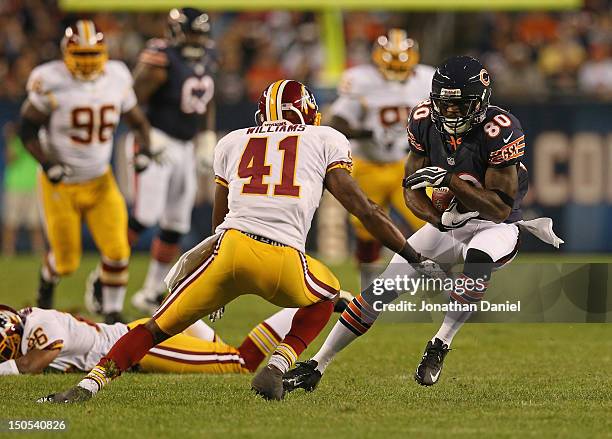 Earl Bennett of the Chicago Bears moves against Madieu Williams of the Washington Redskins during a preseason game at Soldier Field on August 18,...