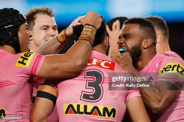 Izack Tago of the Panthers celebrates with Brian To'o of the Panthers and Sunia Turuva of the Panthers during the round 18 NRL match between...