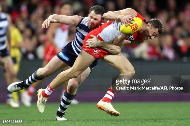 Will Hayward of the Swans is tackled by Patrick Dangerfield of the Cats during the round 16 AFL match between Sydney Swans and Geelong Cats at Sydney...