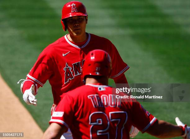 Shohei Ohtani of the Los Angeles Angels celebrates a home run with Mike Trout against the Chicago White Sox in the ninth inning at Angel Stadium of...