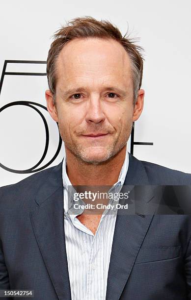 Actor John Benjamin Hickey poses backstage following Victor Garber's performance at 54 Below on August 20, 2012 in New York City.