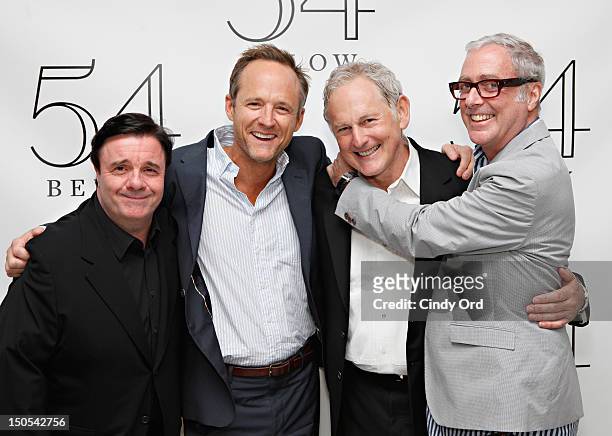 Nathan Lane, John Benjamin Hickey and Scott Wittman pose with actor Victor Garber backstage following his performance at 54 Below on August 20, 2012...