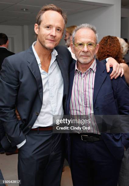 Actors John Benjamin Hickey and Ron Rifkin pose backstage following Victor Garber's performance at 54 Below on August 20, 2012 in New York City.