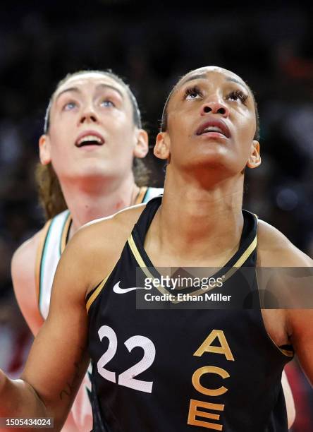 Breanna Stewart of the New York Liberty and A'ja Wilson of the Las Vegas Aces watch a Liberty player shoot a free throw in the third quarter of their...
