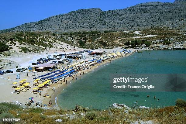 View of the Tsambika Beach on June 25, 2012 in Rhodes, Greece. Rhodes is an island located in the eastern Aegean Sea. Historically, Rhodes was famous...