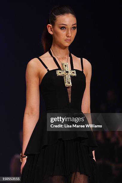 Model showcases designs by Kirrily Johnston on the catwalk as part of Mercedes Benz Fashion Festival Sydney 2012 at Sydney Town Hall on August 21,...