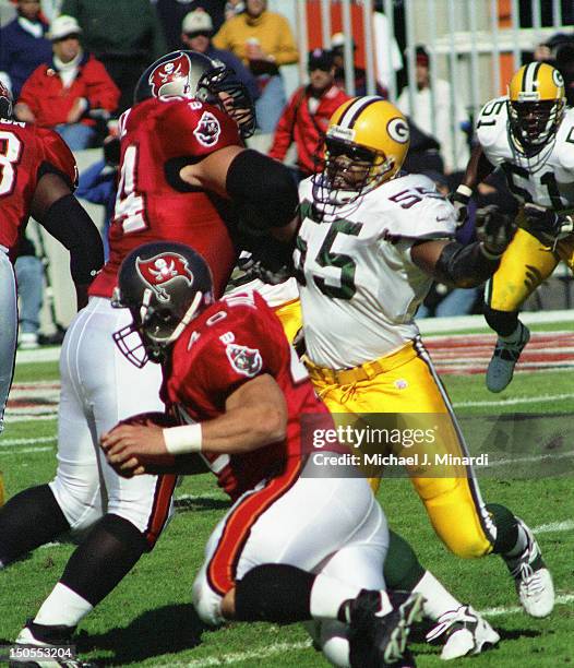 Middle Line Backer Bernardo Harris of the Green Bay Packers goes after Mike Alstott of the tampa Bay Buccaneers in a NFL game at Tampa Stadium on...