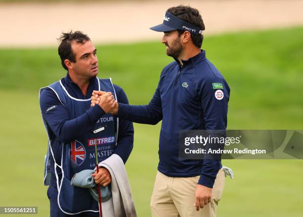 Antoine Rozner of France shakes hands with his caddie on the 9th green during Day Two of the Betfred British Masters hosted by Sir Nick Faldo 2023 at...