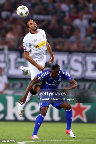 Martin Stranzl of Moenchengladbach and Ideye Brown of Kiew go up for a header during the UEFA Champions League play-off first leg match between...