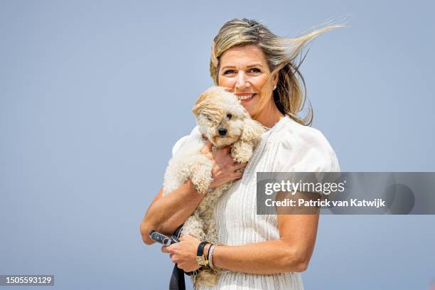 Queen Maxima of The Netherlands with her dog Mambo attends the Dutch Royal Family Summer Photocall at Zuiderstrand on June 30, 2023 in The Hague,...