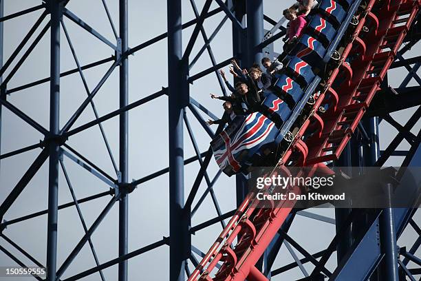 People ride a Rollercoaster at Blackpool Pleasure Beach on August 21, 2012 in Blackpool, England.