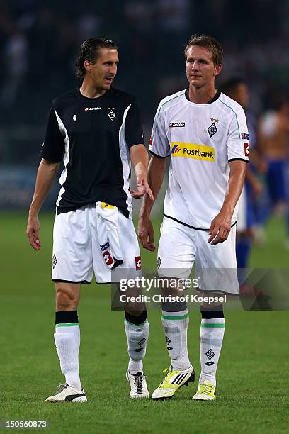 Rouel Brouwers and Luuk de Jong of Moenchengladbach look dejected after losing 1-3 the UEFA Champions League play-off first leg match between...