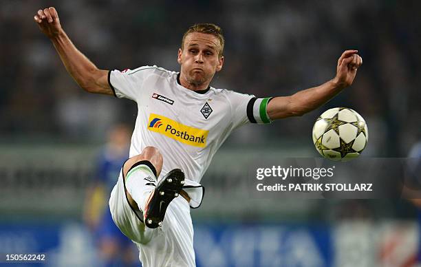 Moenchengladbach's Belgian defender Filip Daems plays the ball during the Champions League Play-off round 1 st leg football match Borussia...