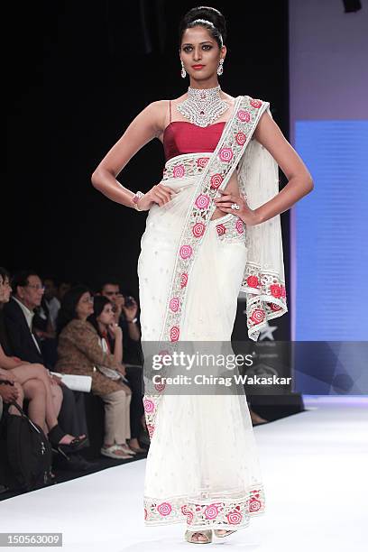 Model walks the runway in a IGI Jewellery design at the India International Jewellery Week 2012 Day 3 at the Grand Hyatt on on August 21, 2012 in...