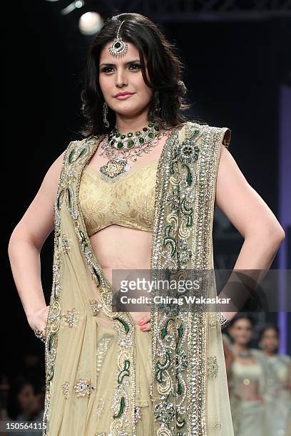 Zarine Khan walks the runway in a YS18 Jewellery design at the India International Jewellery Week 2012 Day 3 at the Grand Hyatt on on August 21, 2012...