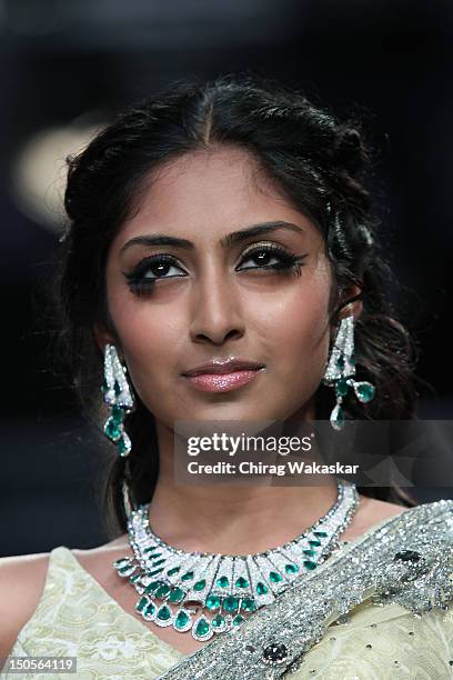 Model walks the runway in a YS18 Jewellery design at the India International Jewellery Week 2012 Day 3 at the Grand Hyatt on on August 21, 2012 in...