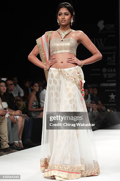 Model walks the runway in a Jewel Trendz Jewellery design at the India International Jewellery Week 2012 Day 3 at the Grand Hyatt on on August 21,...