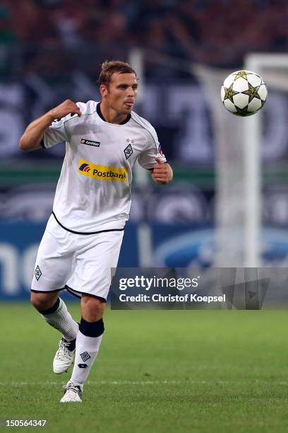 Tony Jantschke of Moenchengladbach runs with the ball during the UEFA Champions League play-off first leg match between Borussia Moenchengladbach and...