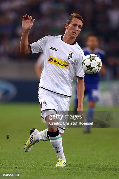 Luuk de Jong of Moenchengladbach runs with the ball during the UEFA Champions League play-off first leg match between Borussia Moenchengladbach and...