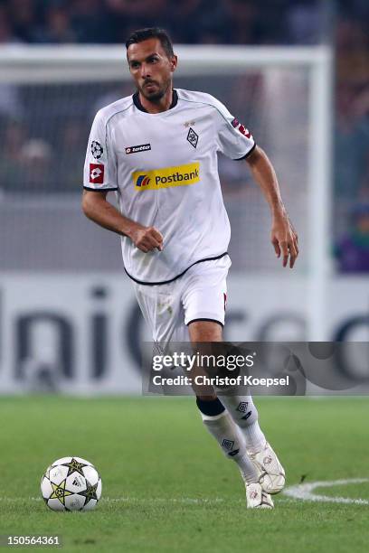 Martin Stranzl of Moenchengladbach runs with the ball during the UEFA Champions League play-off first leg match between Borussia Moenchengladbach and...