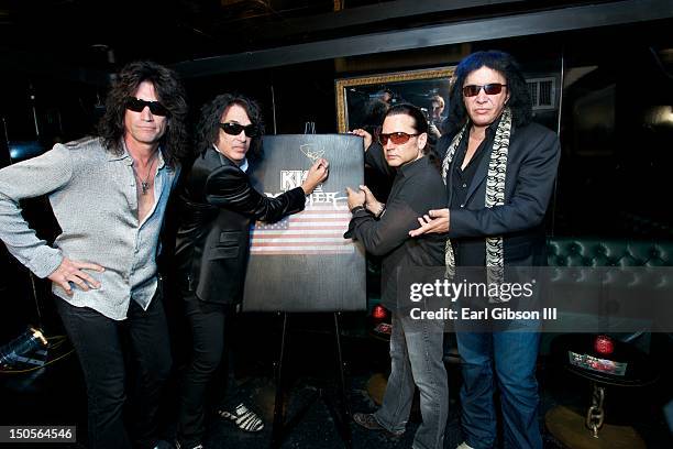 Members of the band KISS Tommy Thayer, Paul Stanley, Eric Singer and Gene Simmons release "KISS Monster Book" at the Viper Room on August 21, 2012 in...