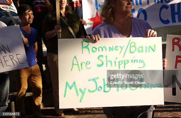 Protesters outside the offices of Bain Capital demonstrate against the company on August 21, 2012 in Evanston, Illinois. The demonstrators are angry...