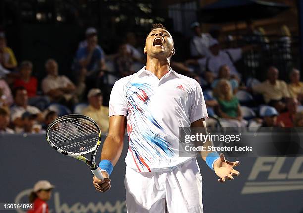 Jo-Wilfried Tsonga of France reacts to a point during his match against Thomaz Bellucci of Brazil in the second round of the Winston-Salem Open at...