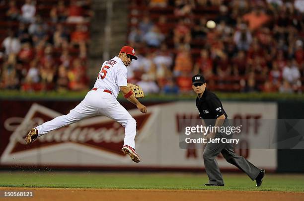 Rafael Furcal of the St. Louis Cardinals watches the ball after throwing on the run against the Houston Astros at Busch Stadium on August 21, 2012 in...