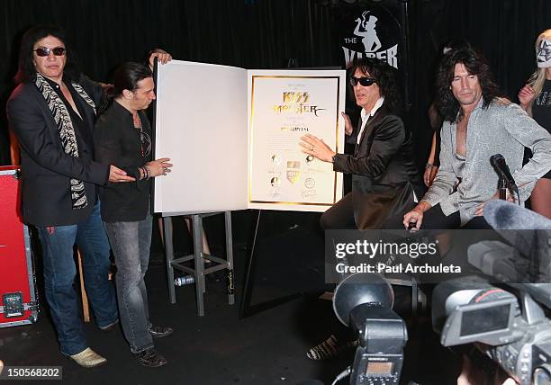Gene Simmons, Eric Singer, Paul Stanley and Tommy Thayer of the Rock Band KISS attend the launch of the KISS Monster Book at the Viper Room on August...