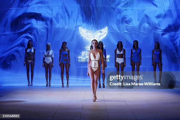 Models showcase designs by Lisa Blue during the Miami Swim show on the catwalk as part of the Mercedes-Benz Fashion Festival Sydney 2012 at Sydney...