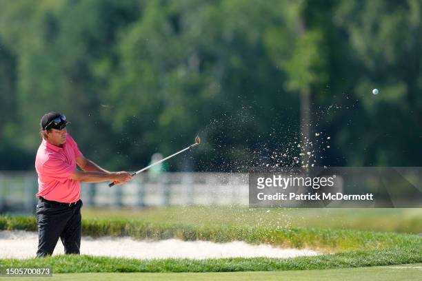 Stephen Ames of the United States hits from a bunker on the 12th hole during the second round of the U.S. Senior Open Championship at SentryWorld on...