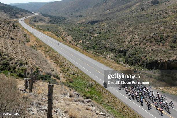 The peloton heads down the road during stage two of the USA Pro Challenge from Montrose to Crested Butte on August 21, 2012 in Montrose, Colorado.