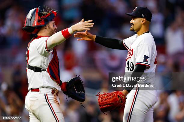 Pitcher Pablo Lopez of the Minnesota Twins celebrates his complete-game shutout against the Kansas City Royals with Ryan Jeffers at Target Field on...