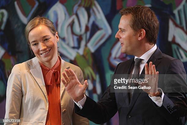 German Family Minister Kristina Schroeder and Health Minister Daniel Bahr arrive for the weekly German government cabinet meeting on August 22, 2012...